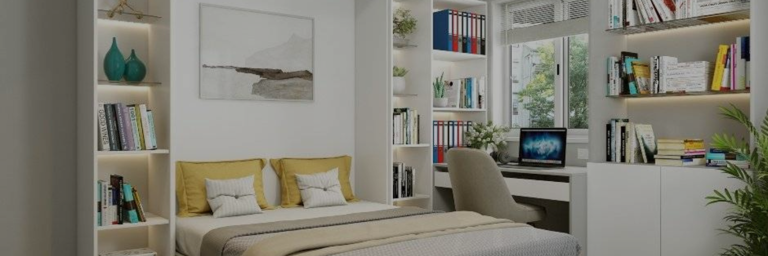 Cozy bedroom with a bed, bookshelves, a desk with a computer, and natural light from a window, creating a serene study space.